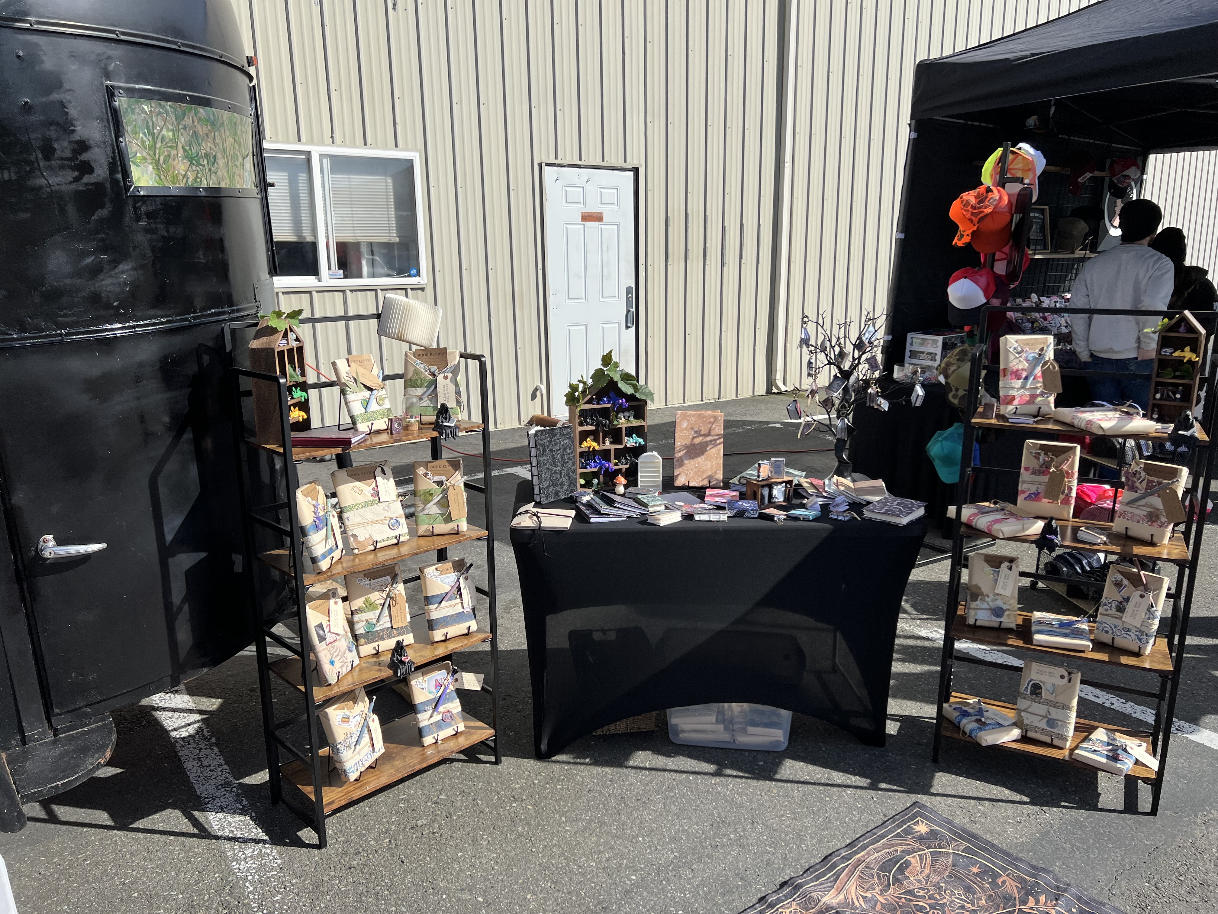 Outdoor display shelves with blind dates and bookish goods